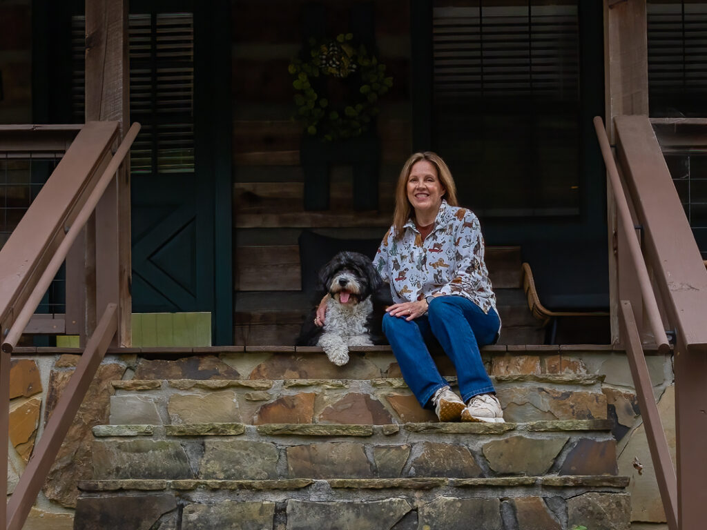 Woman sitting with dog on steps