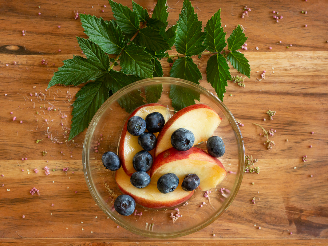 a bowl of fruit and blueberries