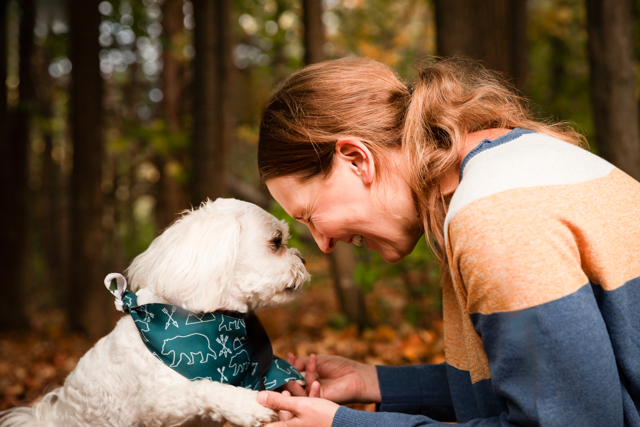 a woman petting a dog